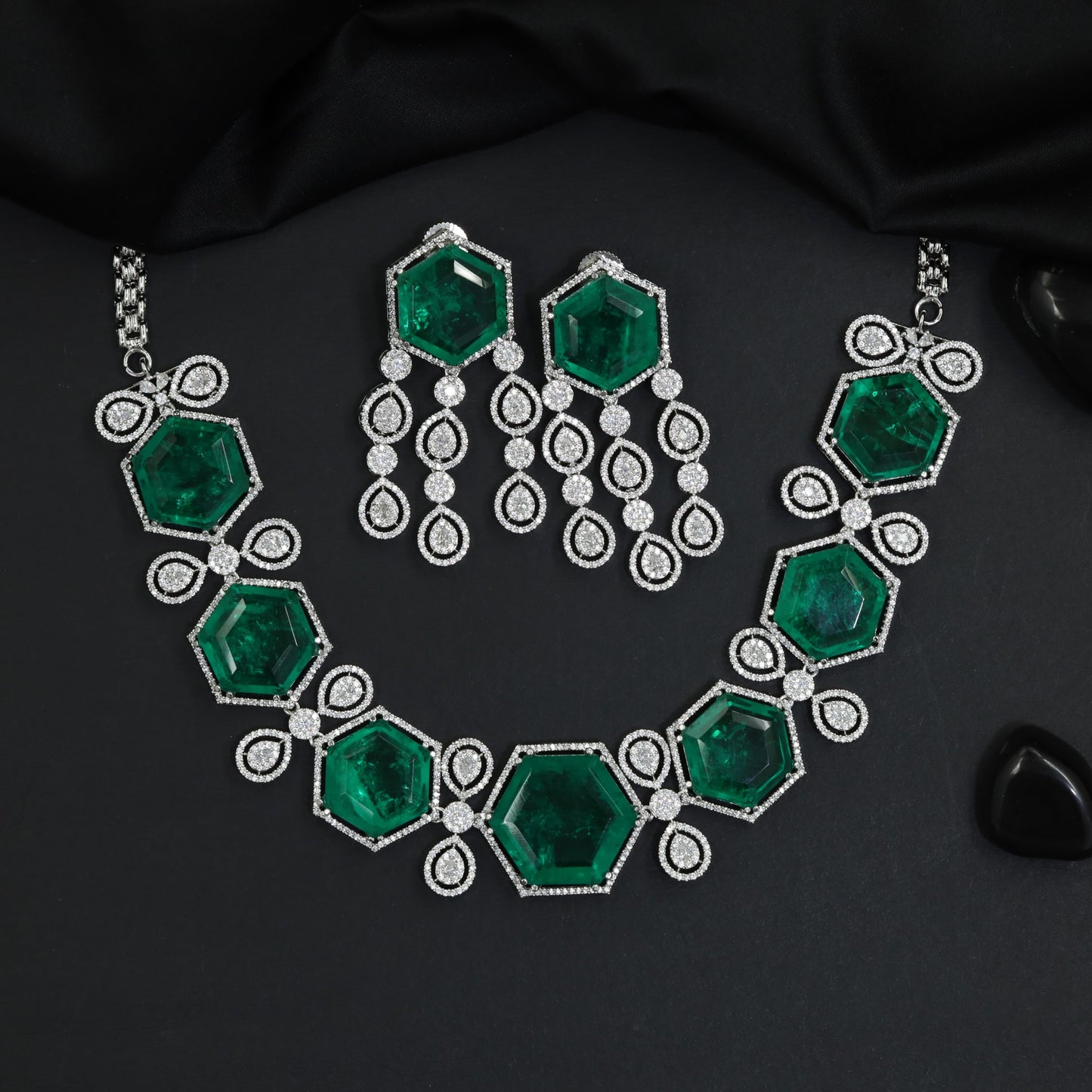 Fine polished frame rhodium necklace featuring graduating geometric linked medallions