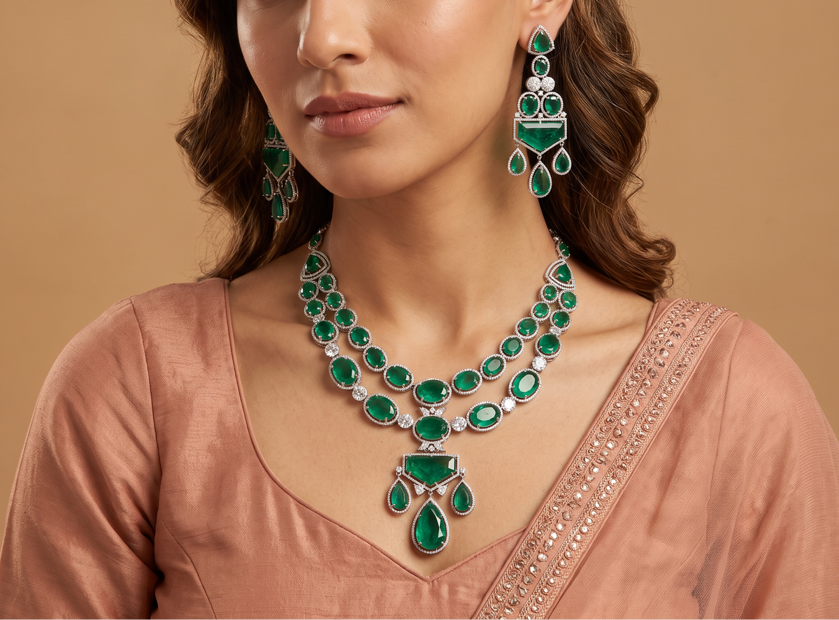 Fine polished multi-row oval strand rhodium long haara featuring a structural centerpiece