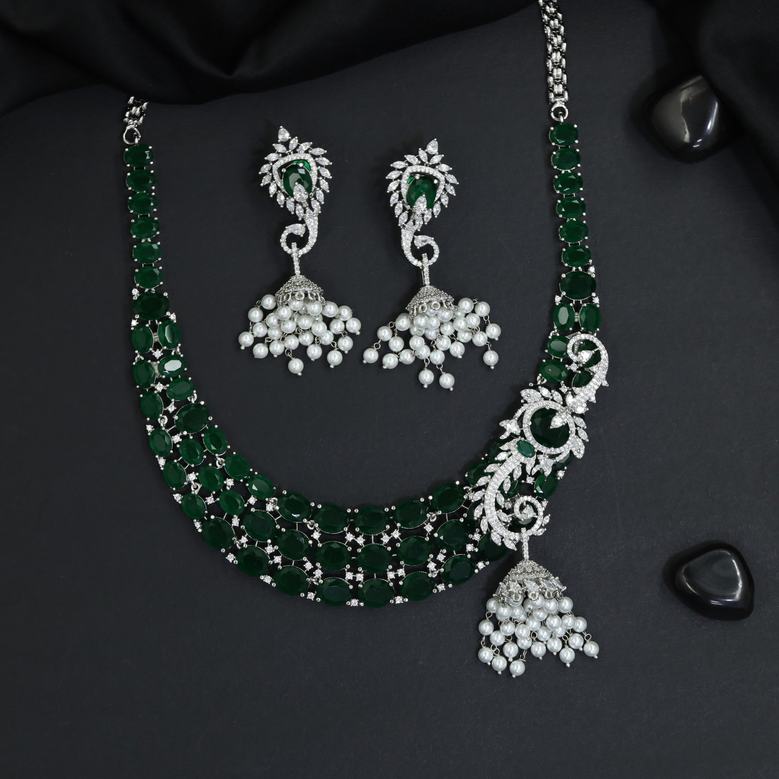 Traditional multi-row oval plaque rhodium necklace set with a hanging jhumka tassel