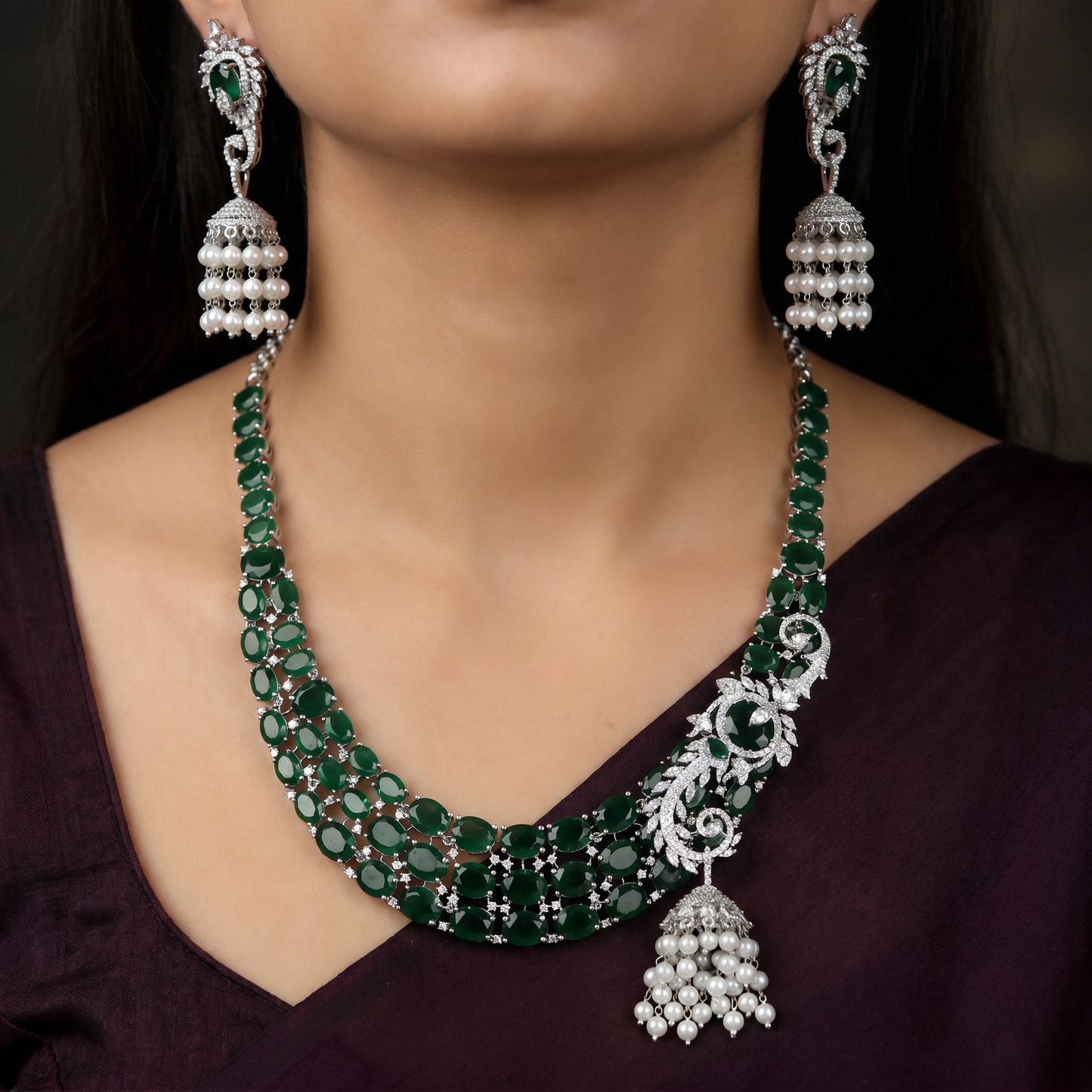 Traditional multi-row oval plaque rhodium necklace set with a hanging jhumka tassel