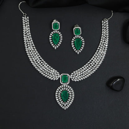 Traditional multi-row pave band rhodium necklace set with a teardrop pendant