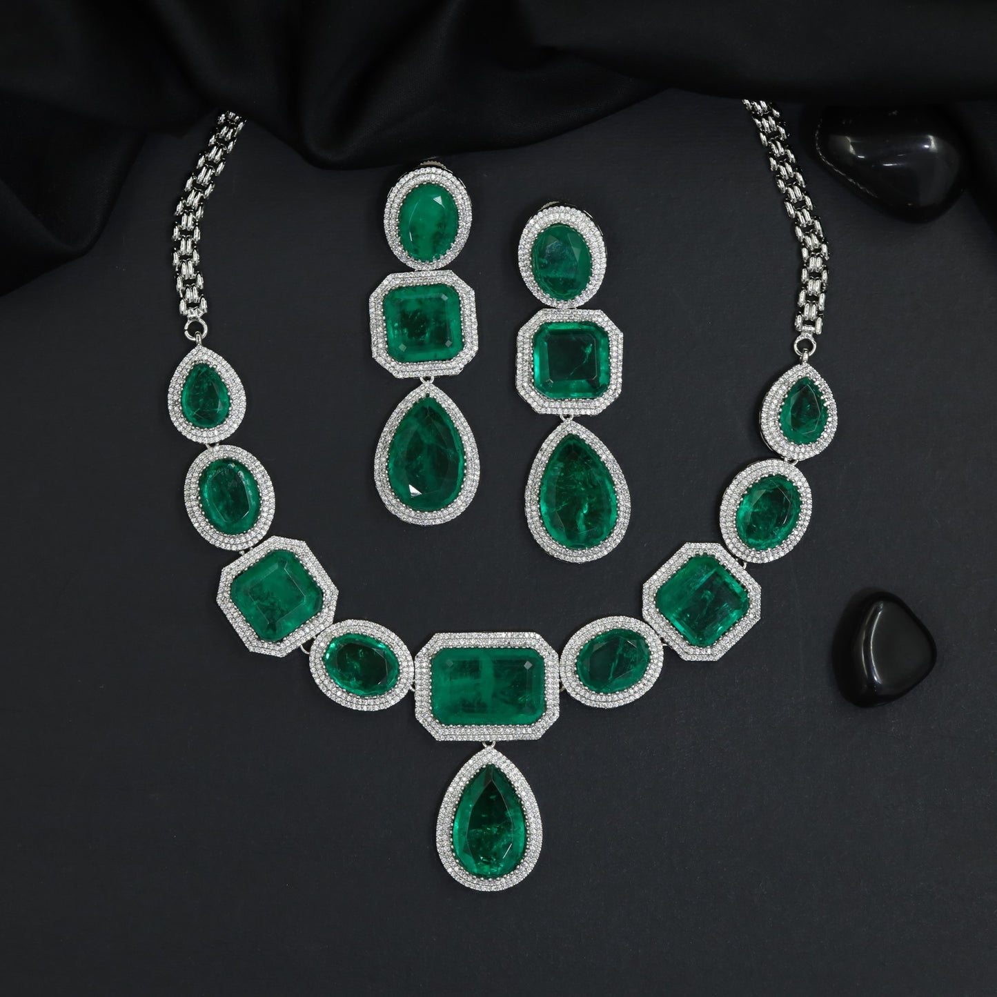 Traditional geometric plaque rhodium necklace set with a central teardrop drop