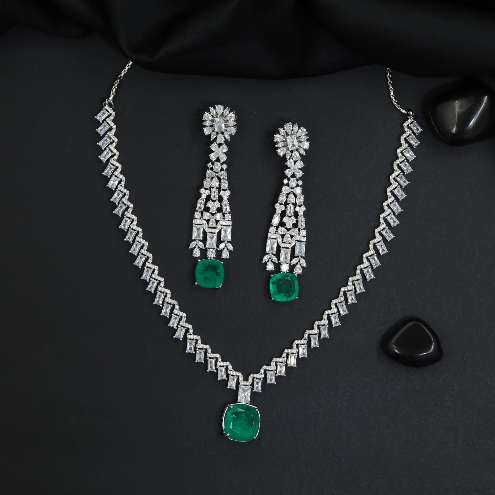 Couture rhodium necklace showcasing structured pendant framework