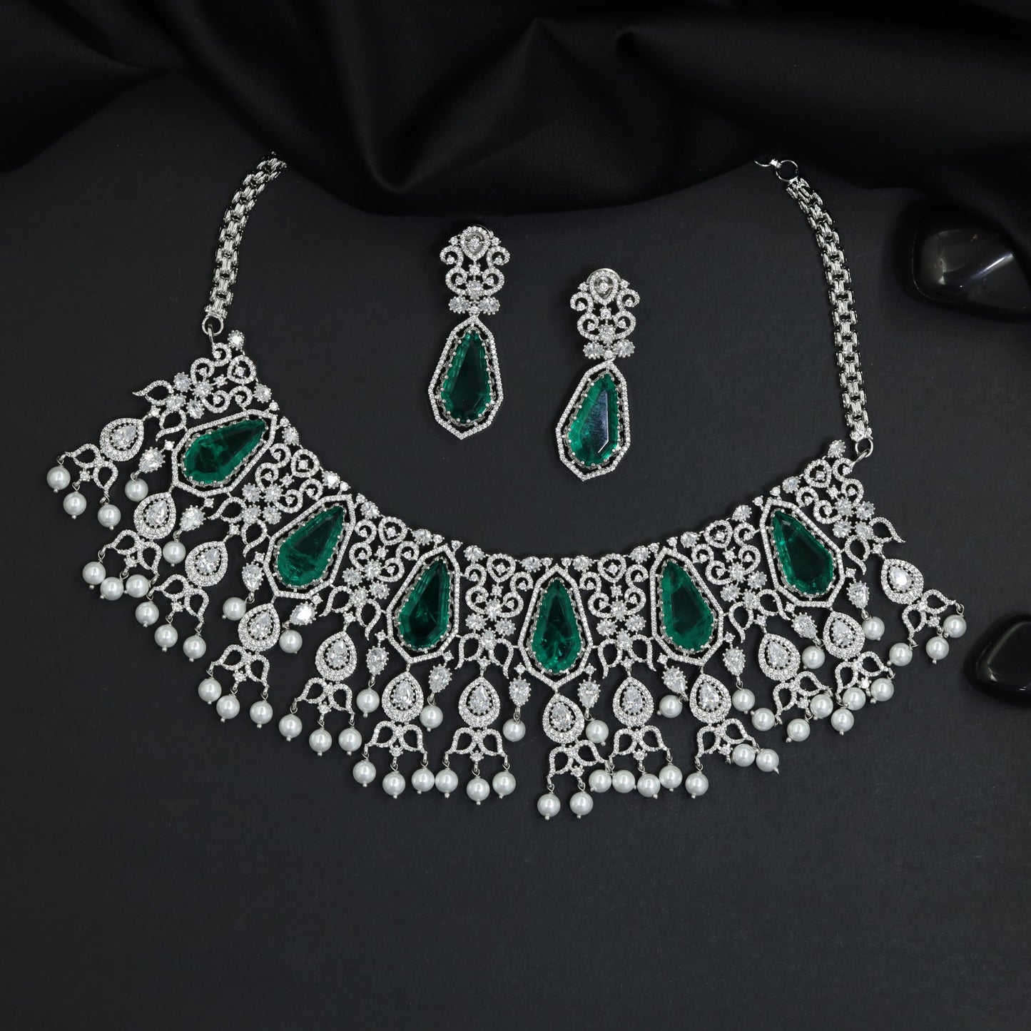 Signature rhodium long haara featuring couture symmetrical artistry