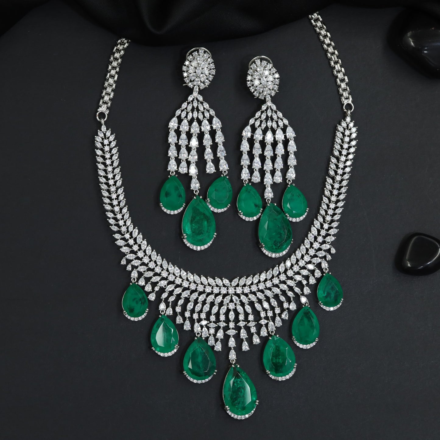 Architectural rhodium necklace with sculpted gemstone sequence