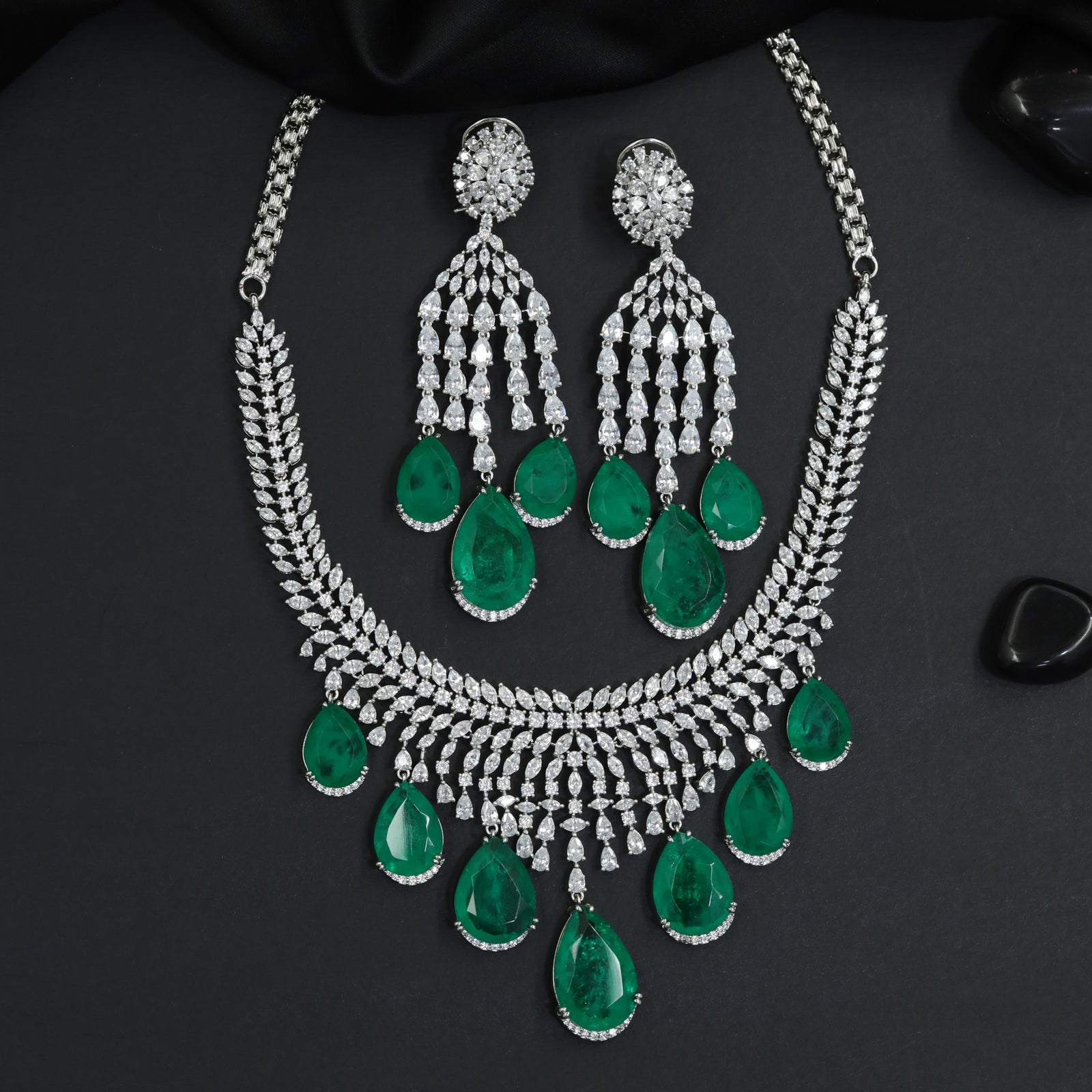 Architectural rhodium necklace with sculpted gemstone sequence