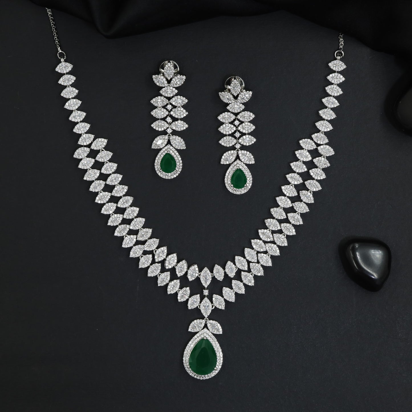 Bold rhodium necklace featuring statement gemstone silhouette