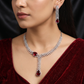 Statement V-Drape Rhodium Necklace Set with Elongated Drop Design