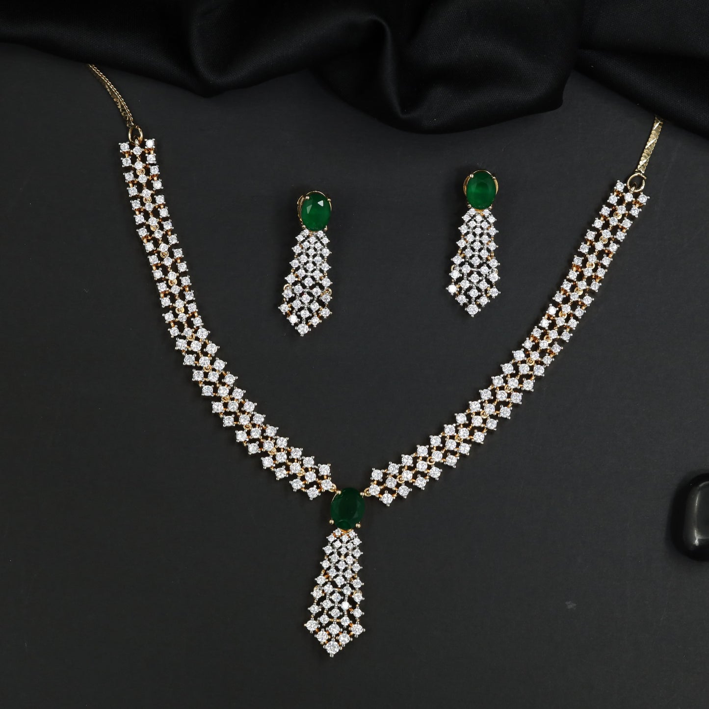 Elevated Gj necklace featuring ornamental gemstone artistry