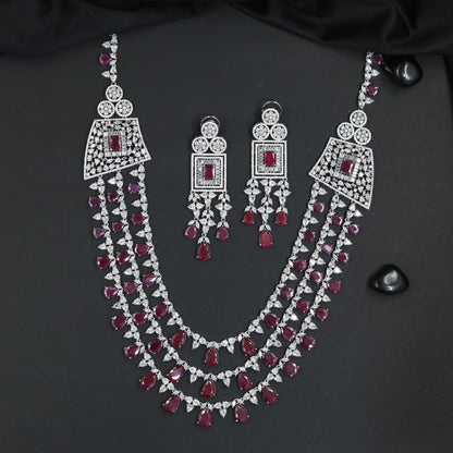Triple Strand Rhodium Long Haara with Geometric Medallion Accents