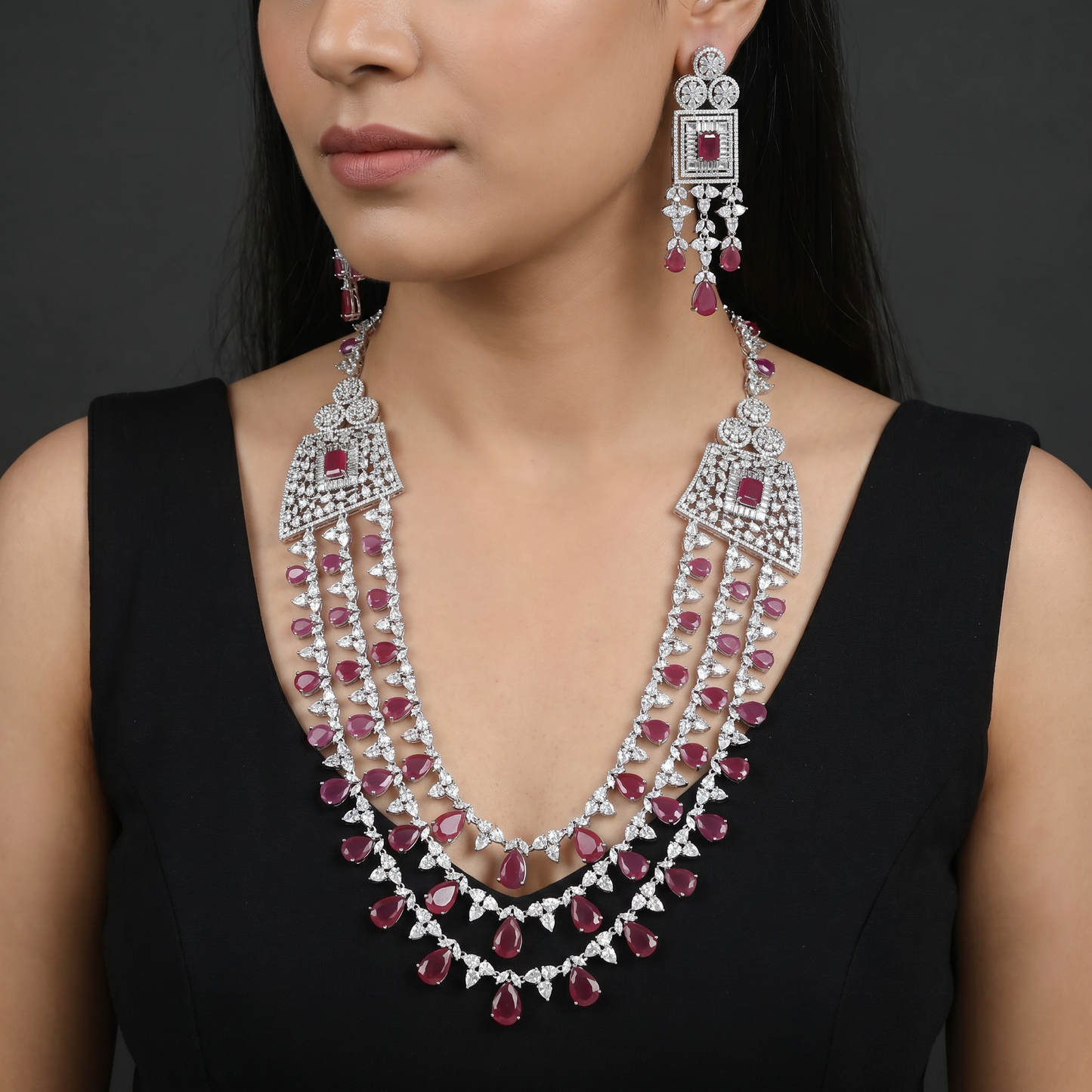 Triple Strand Rhodium Long Haara with Geometric Medallion Accents