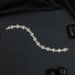 Rhodium Bracelet with Repeating Cushion Elements and Floral Clusters