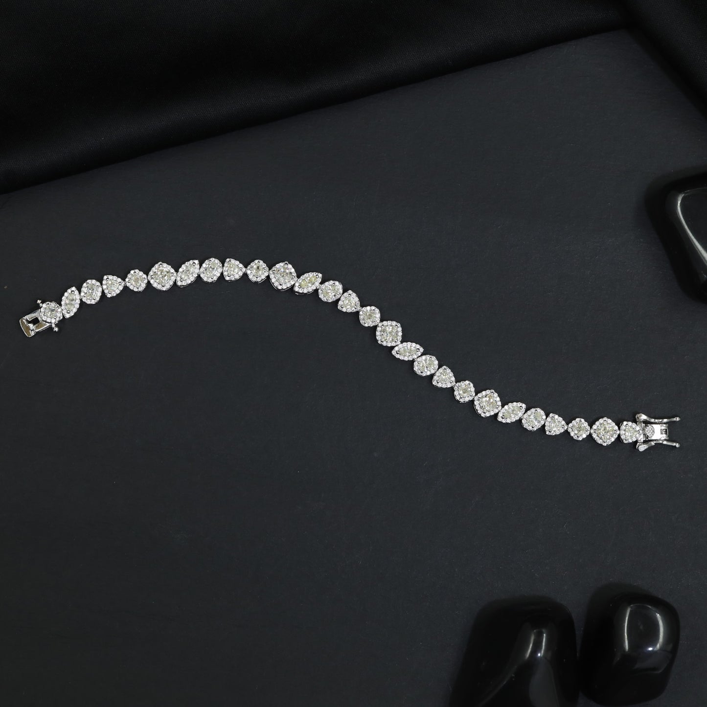 Contemporary Rhodium Bracelet with Alternating Floral and Leaf Design