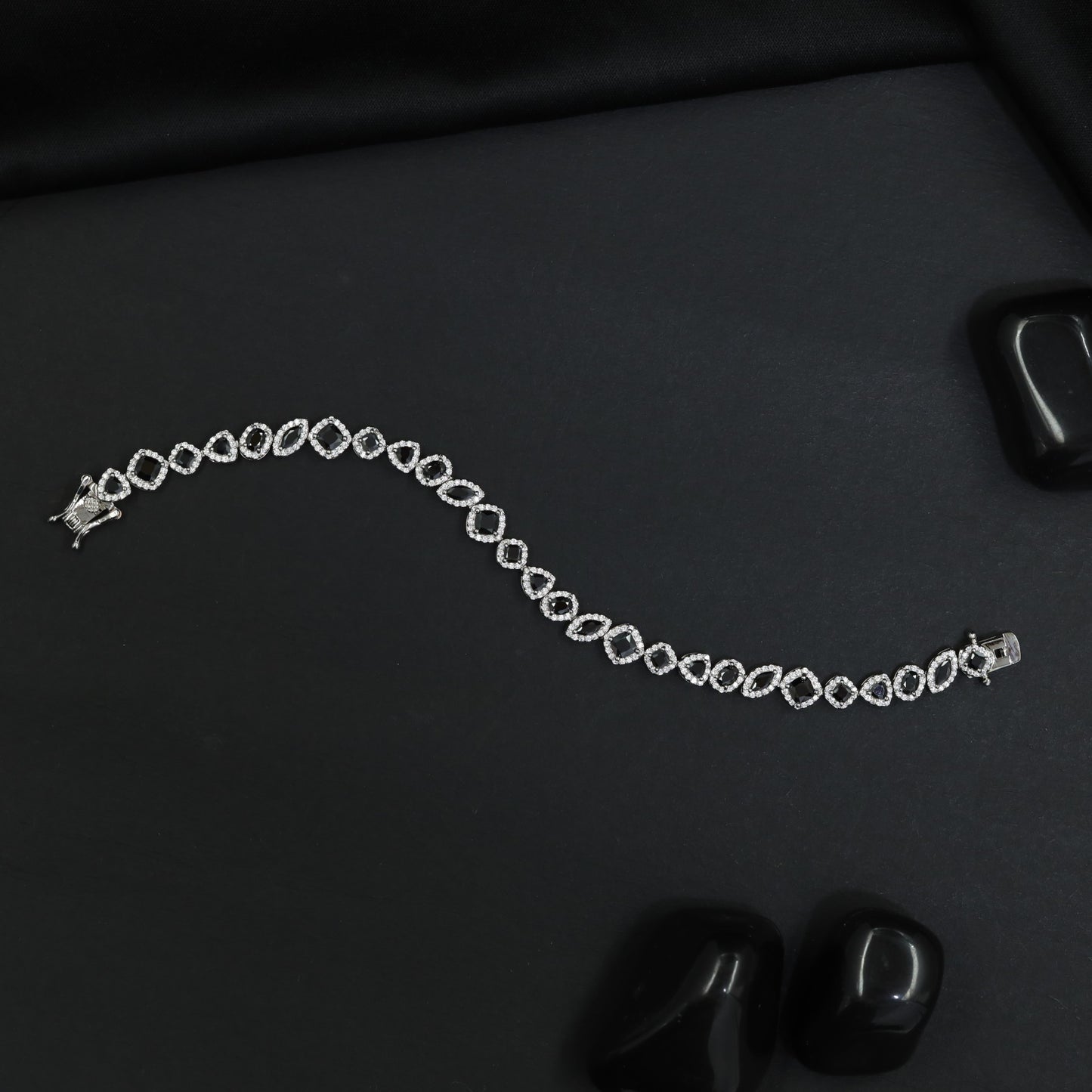 Contemporary Rhodium Bracelet with Alternating Floral and Leaf Design