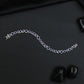 Contemporary Rhodium Bracelet with Alternating Floral and Leaf Design
