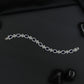 Rhodium Bracelet with Repeating Rosette Elements and Circular Links