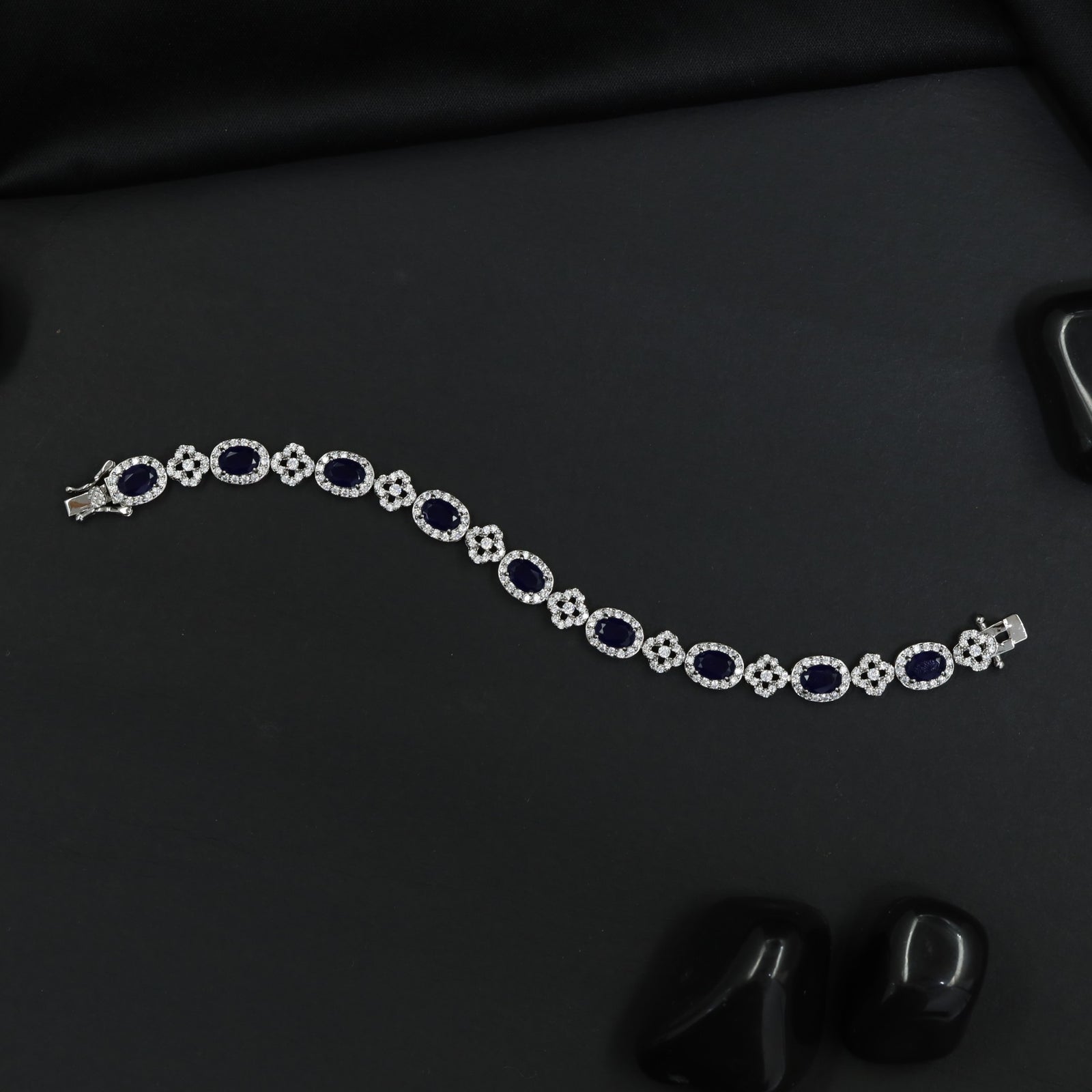 Rhodium Bracelet with Repeating Rosette Elements and Circular Links