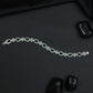 Rhodium Bracelet with Repeating Rosette Elements and Circular Links