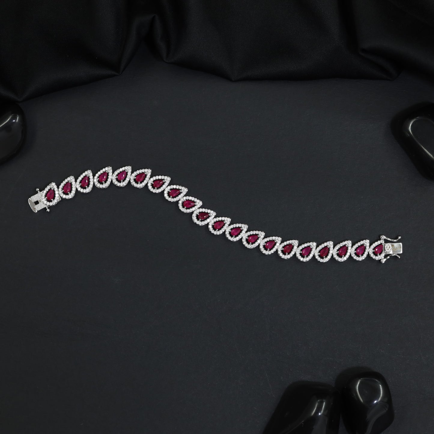 Rhodium Bracelet Featuring Decorative Leaf Links and Continuous Flow