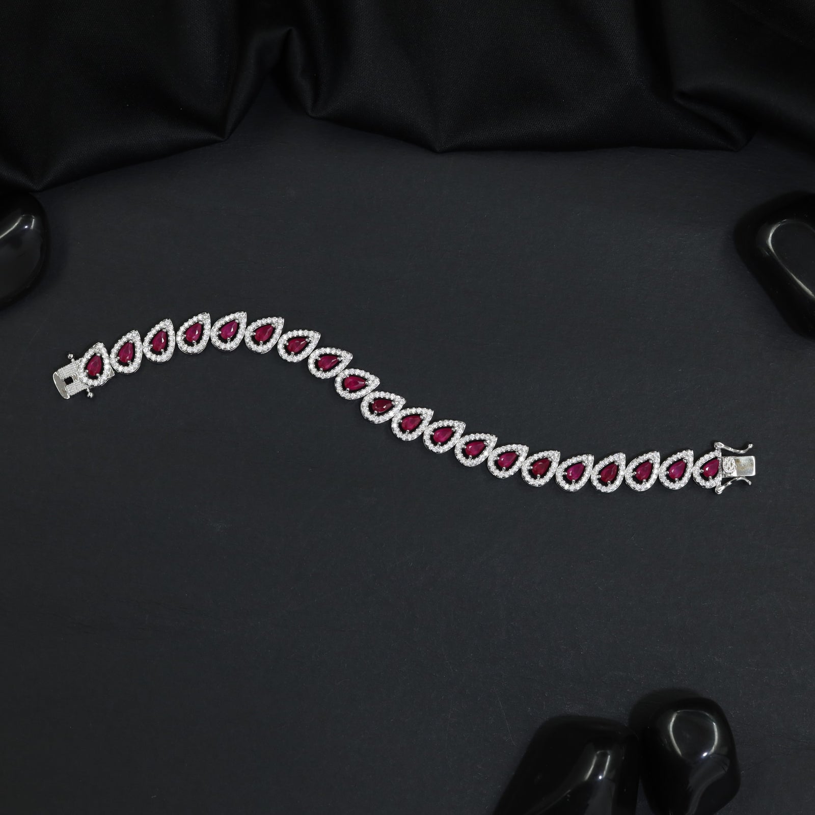 Rhodium Bracelet Featuring Decorative Leaf Links and Continuous Flow