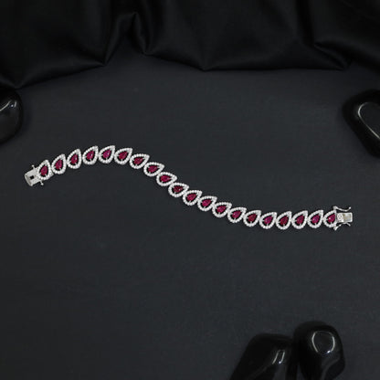 Rhodium Bracelet Featuring Decorative Leaf Links and Continuous Flow