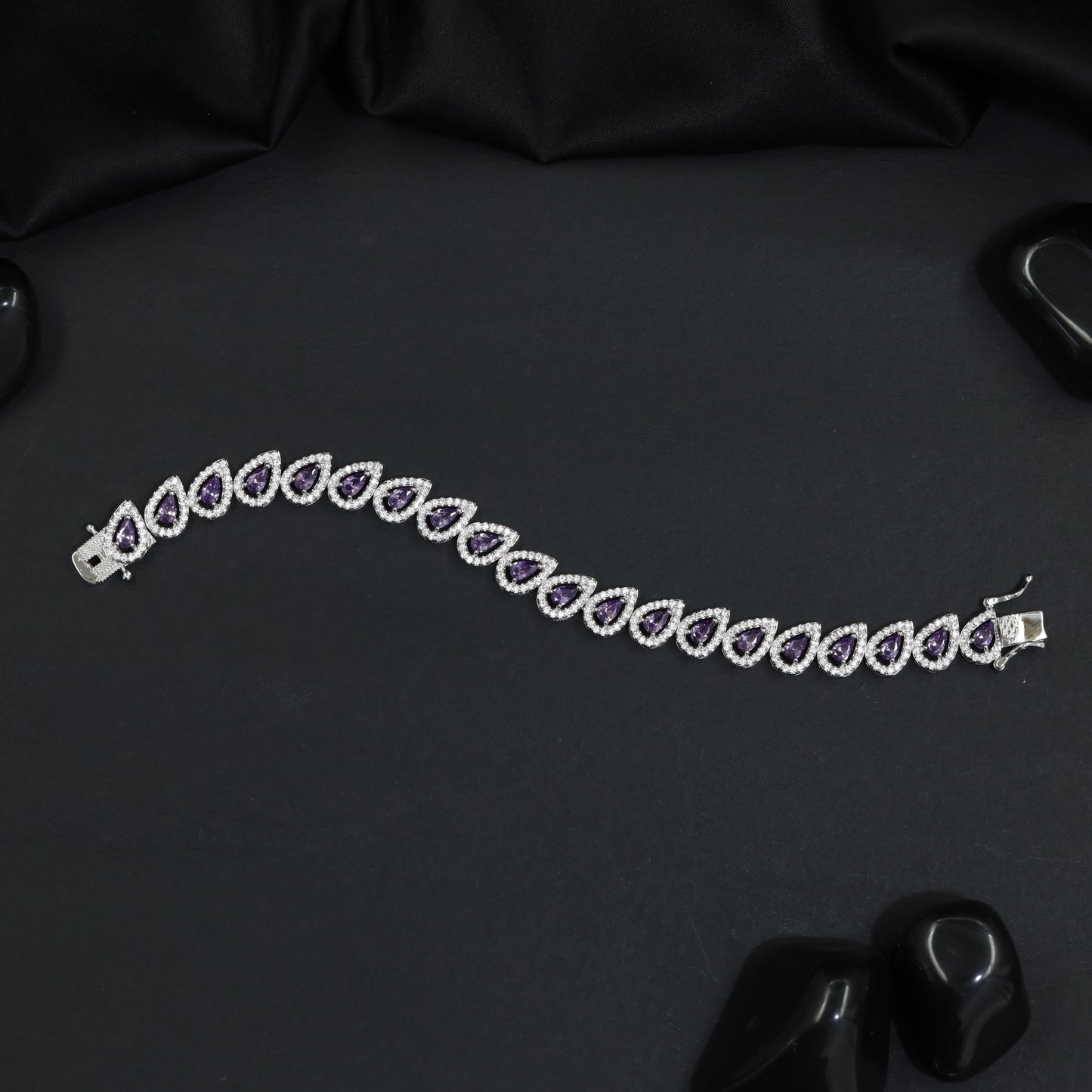 Rhodium Bracelet Featuring Decorative Leaf Links and Continuous Flow