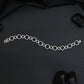 Elegant Rhodium Bracelet with Geometric Links and Circular Elements