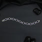 Elegant Rhodium Bracelet with Geometric Links and Circular Elements