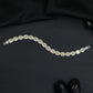 Distinctive rhodium bracelet featuring ornamental oval accents