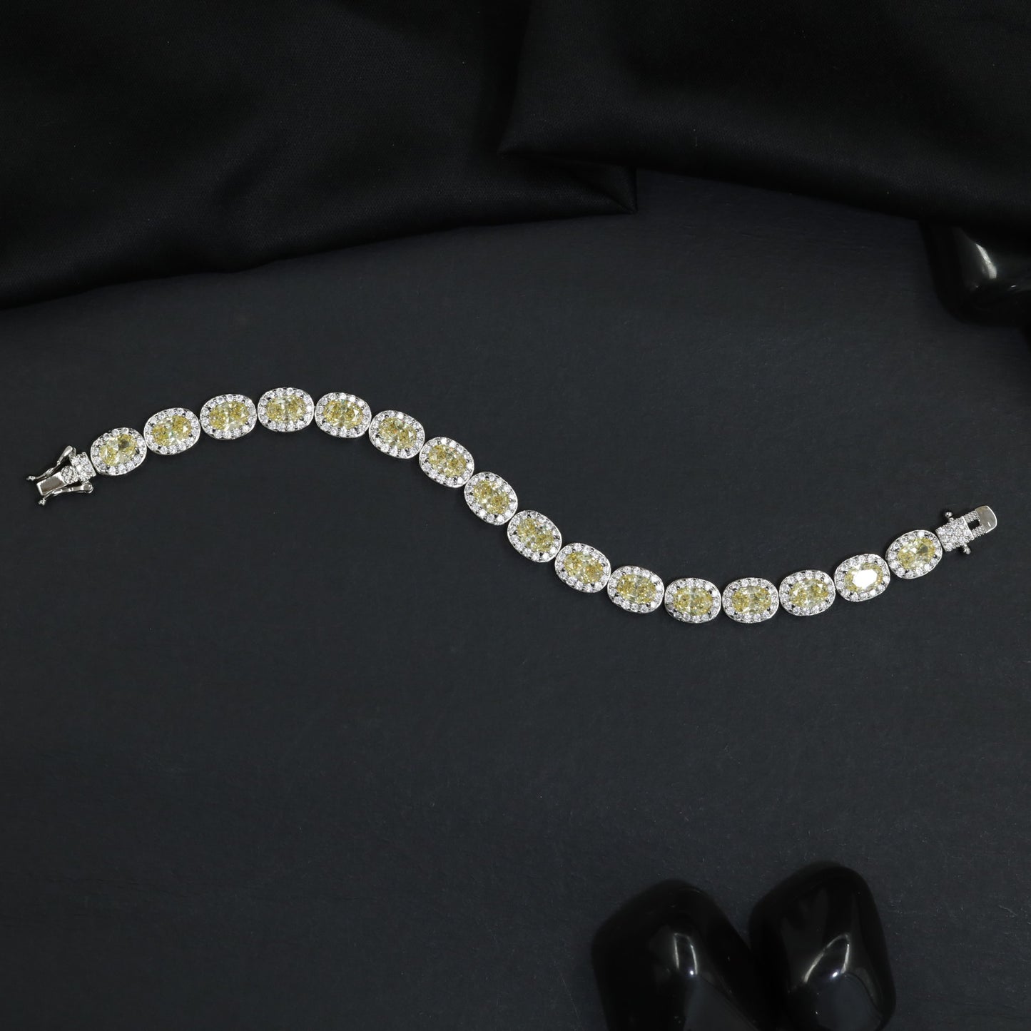 Distinctive rhodium bracelet featuring ornamental oval accents