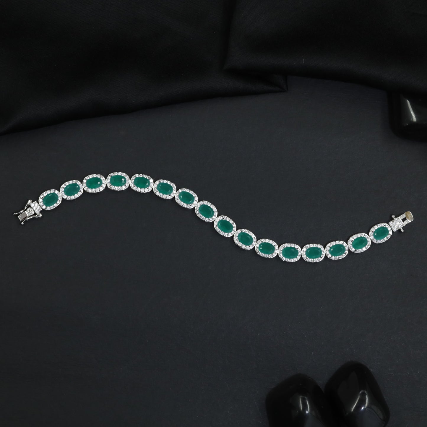 Distinctive rhodium bracelet featuring ornamental oval accents