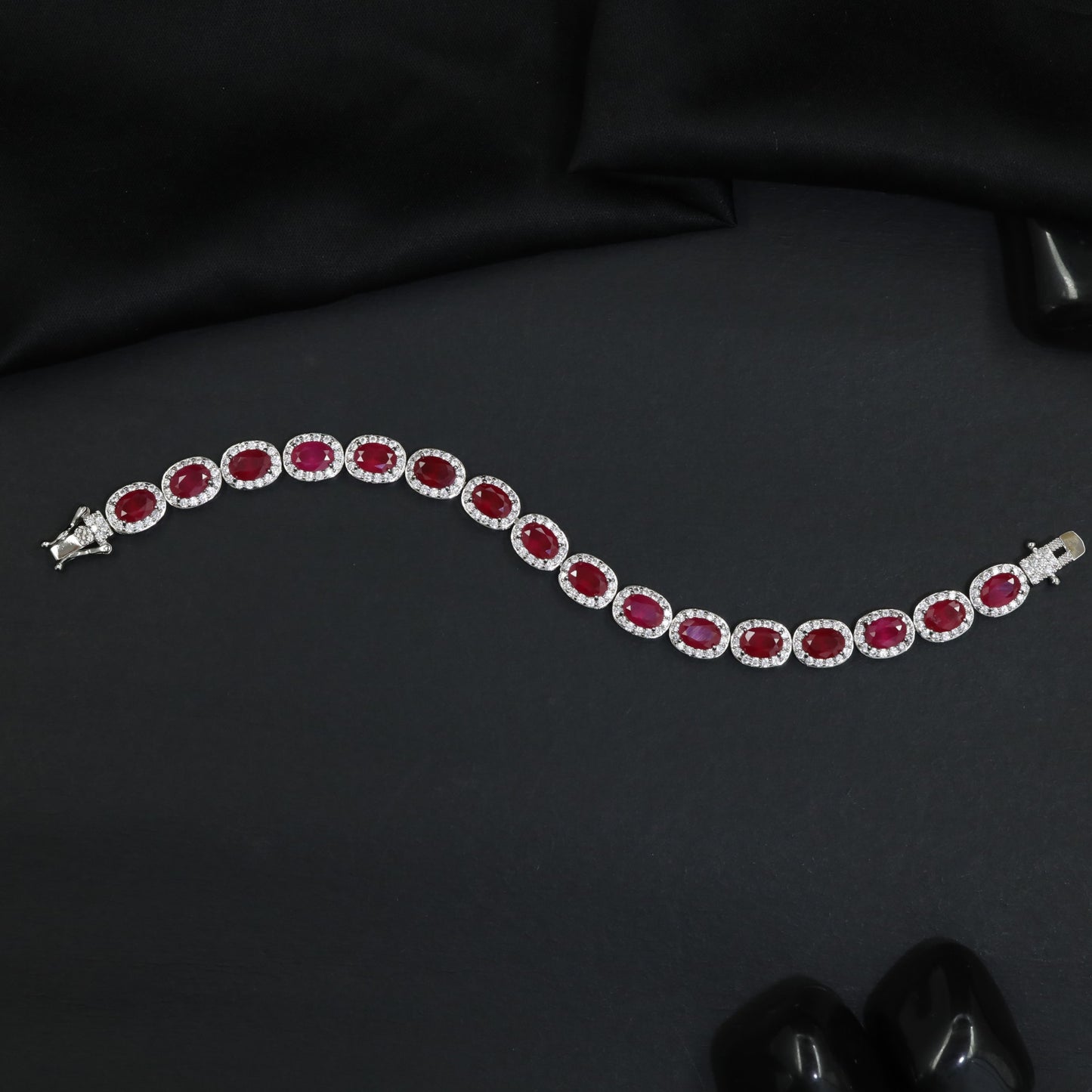Distinctive rhodium bracelet featuring ornamental oval accents