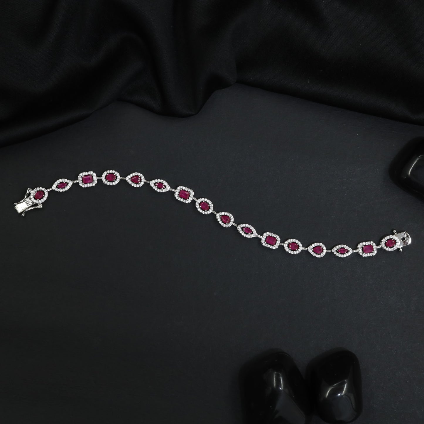 Refined rhodium bracelet with radiant bordered panels