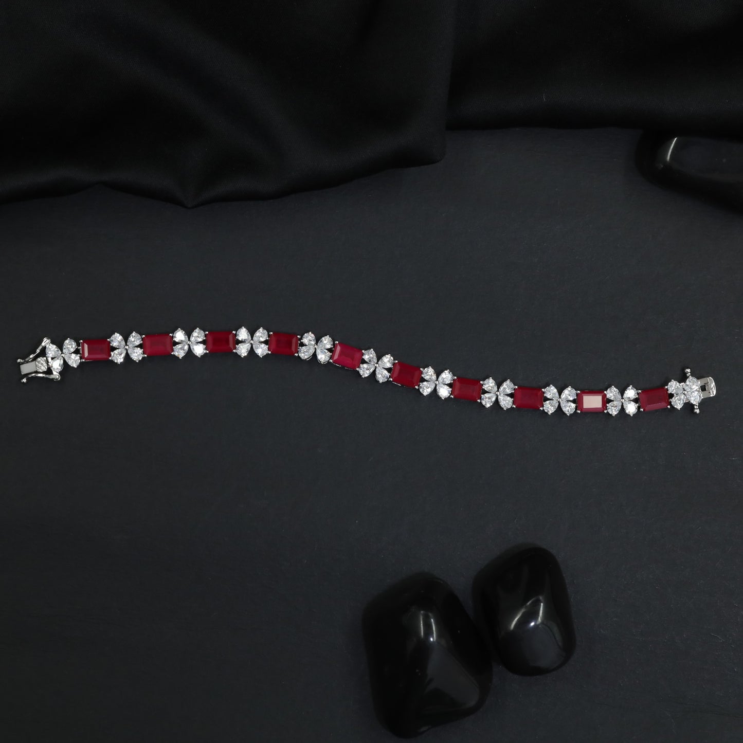 Radiant rhodium bracelet with ribbon‑style silhouettes