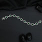 Artisan rhodium bracelet showcasing alternating square links