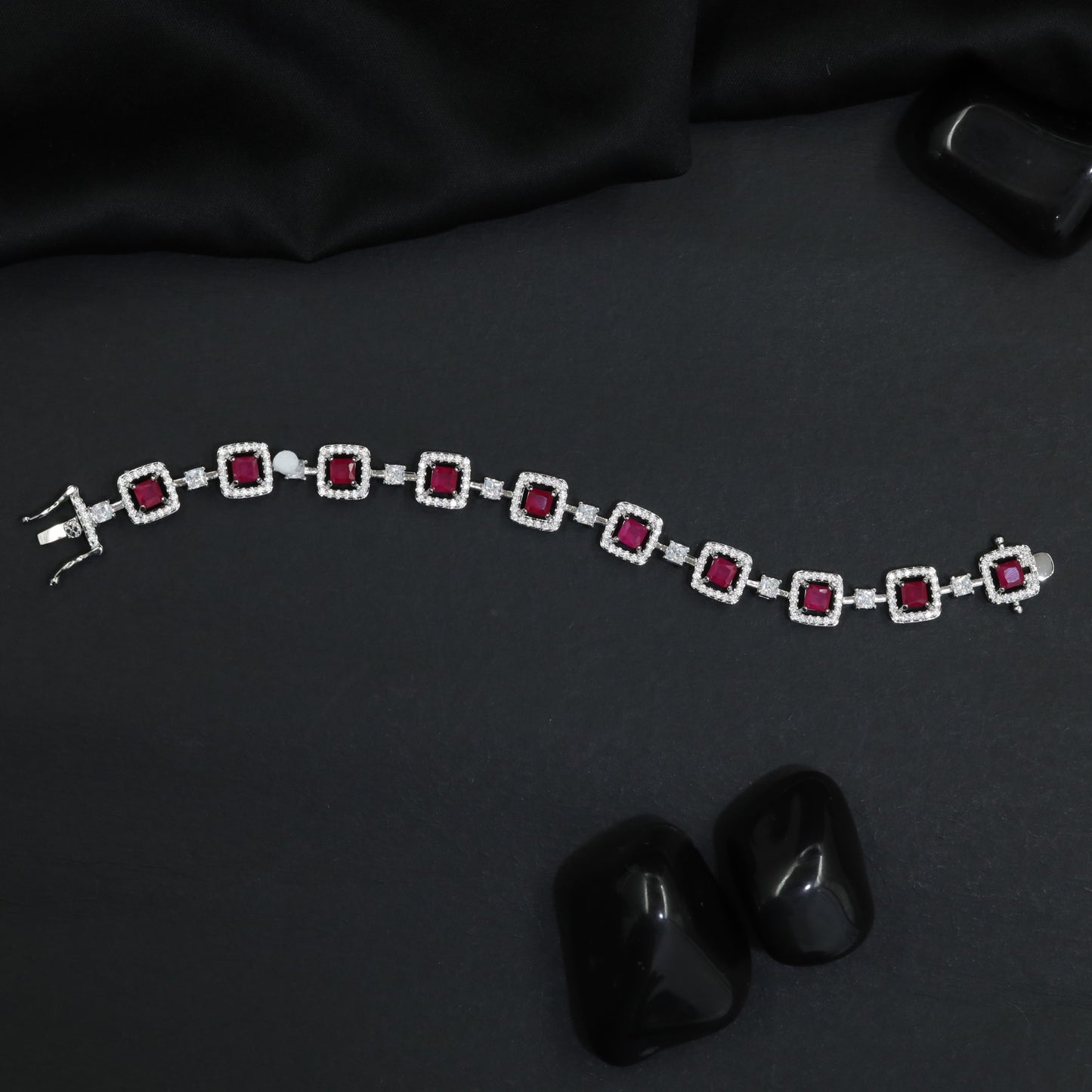 Artisan rhodium bracelet showcasing alternating square links