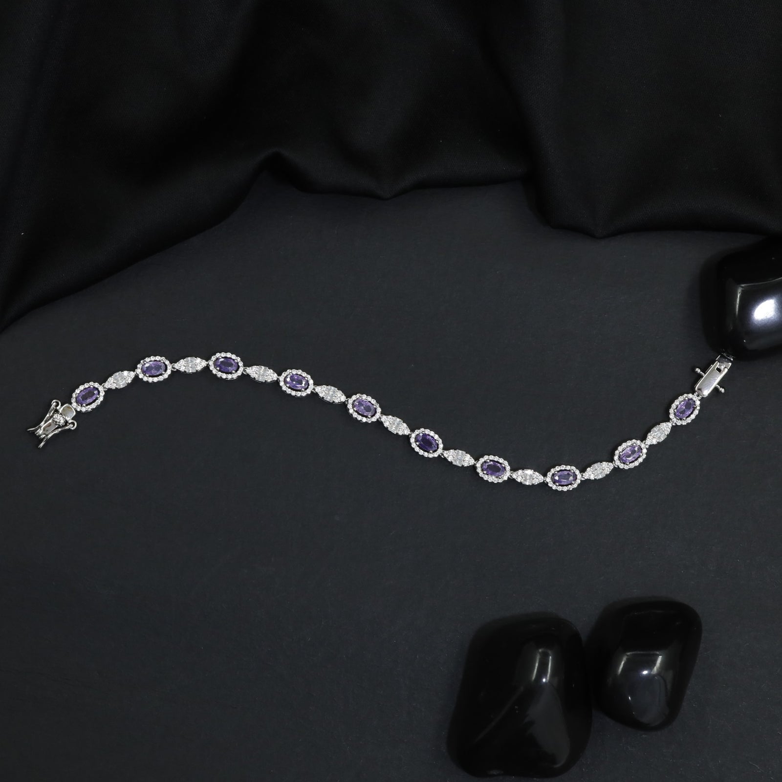 Rhodium Bracelet with Repeating Circular Elements and Decorative Leaf Links
