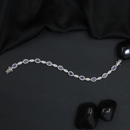 Rhodium Bracelet with Repeating Circular Elements and Decorative Leaf Links