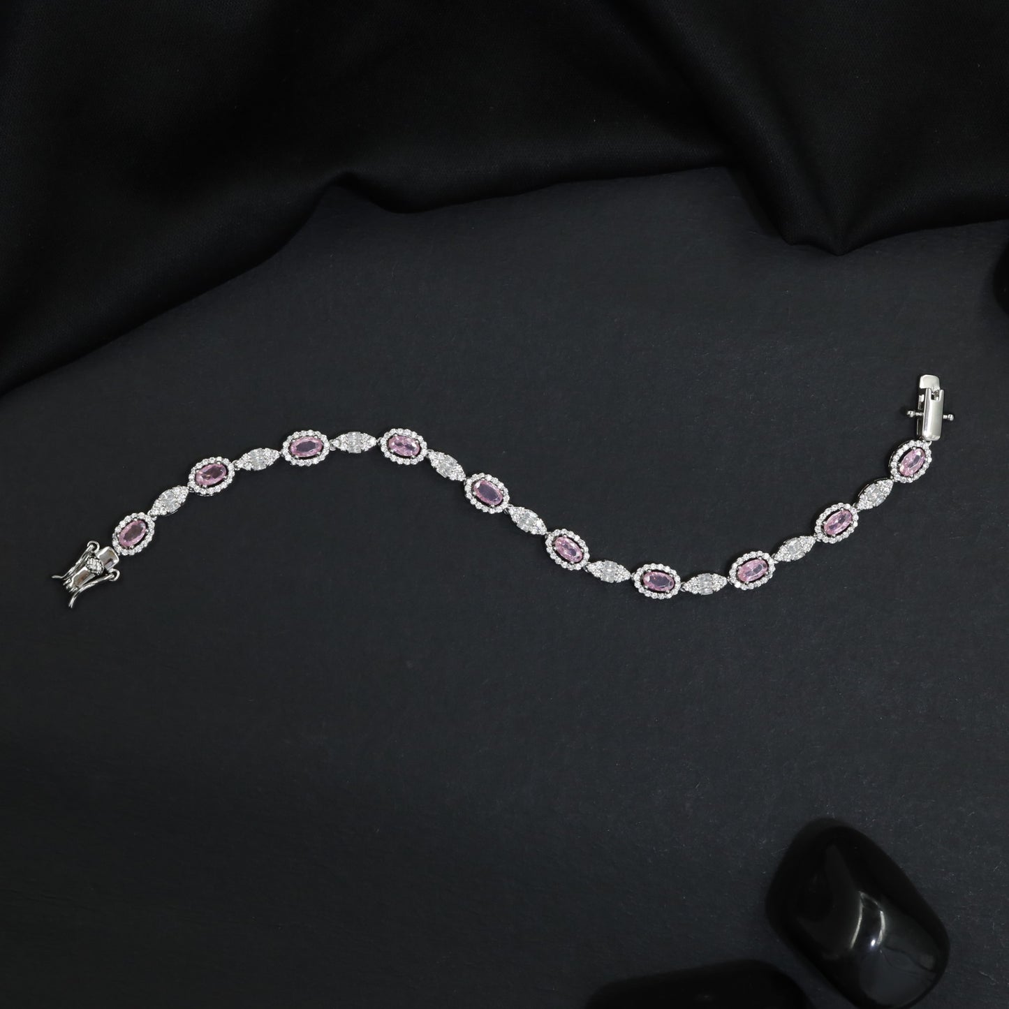 Rhodium Bracelet with Repeating Circular Elements and Decorative Leaf Links