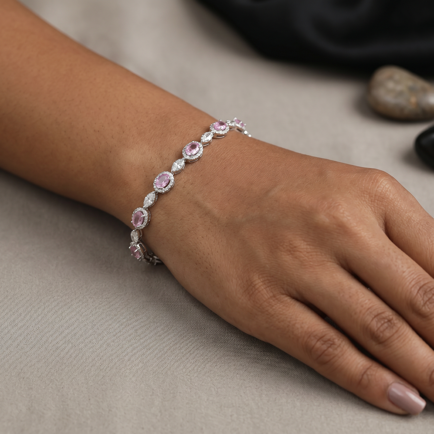 Rhodium Bracelet with Repeating Circular Elements and Decorative Leaf Links