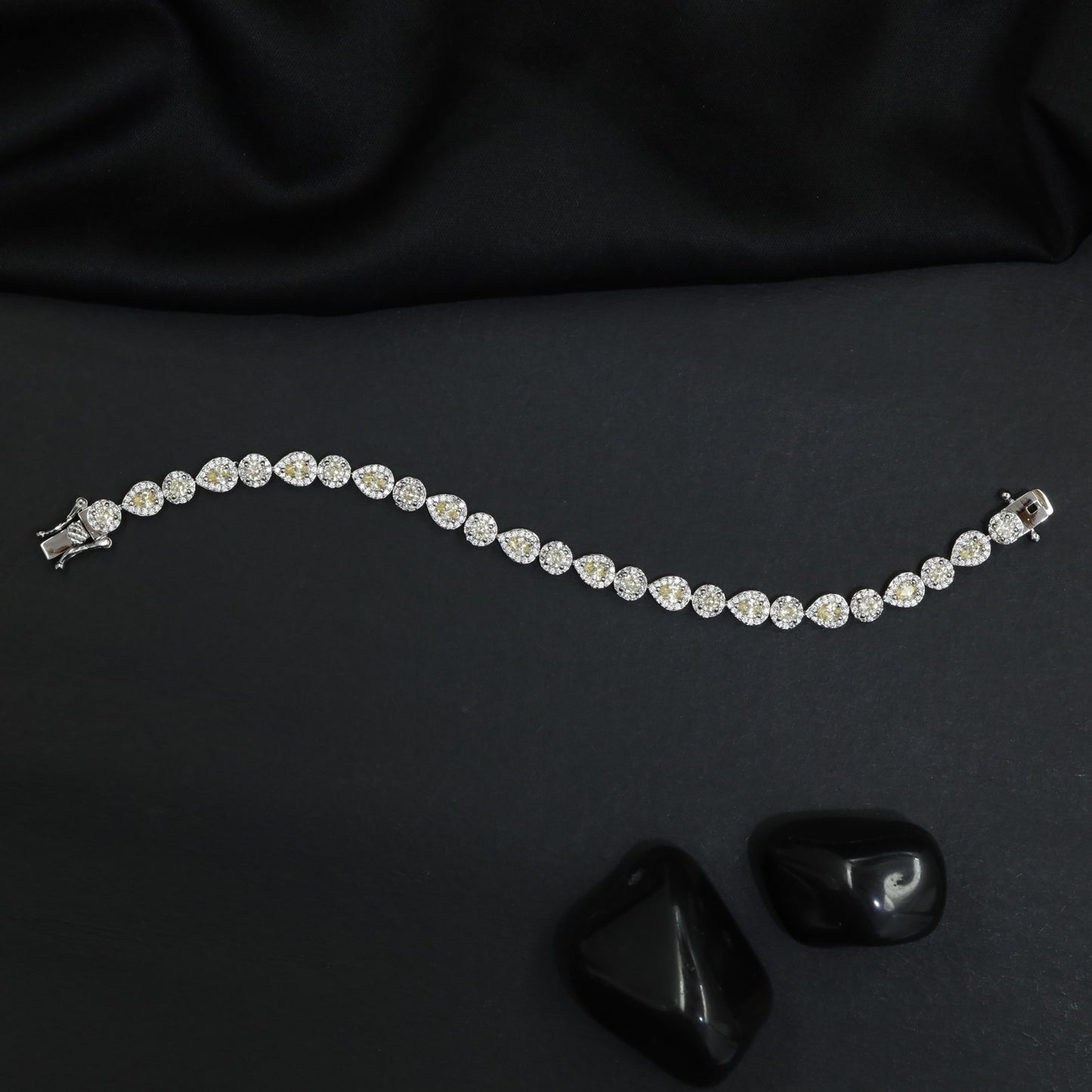 Rhodium Bracelet Featuring Alternating Leaf Elements and Round Links