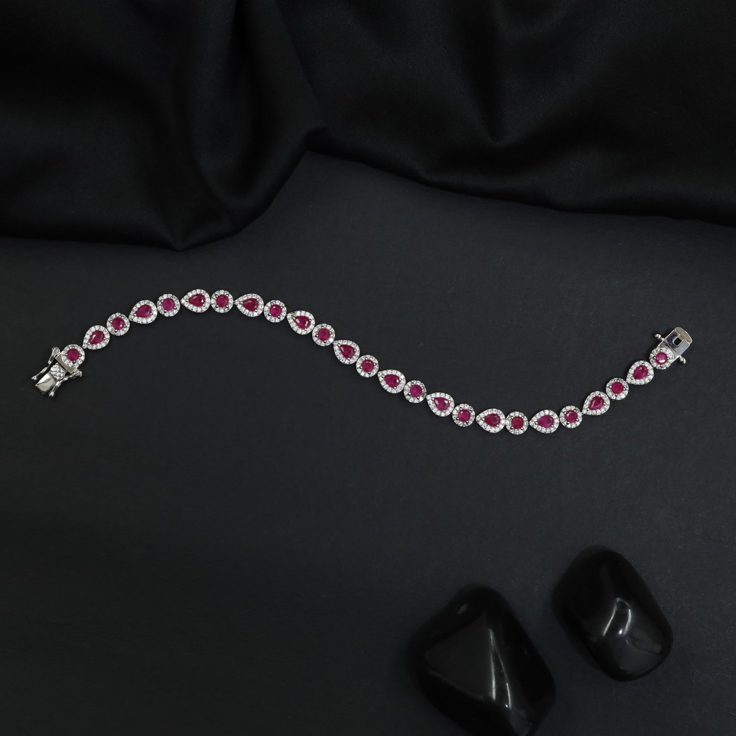 Rhodium Bracelet Featuring Alternating Leaf Elements and Round Links