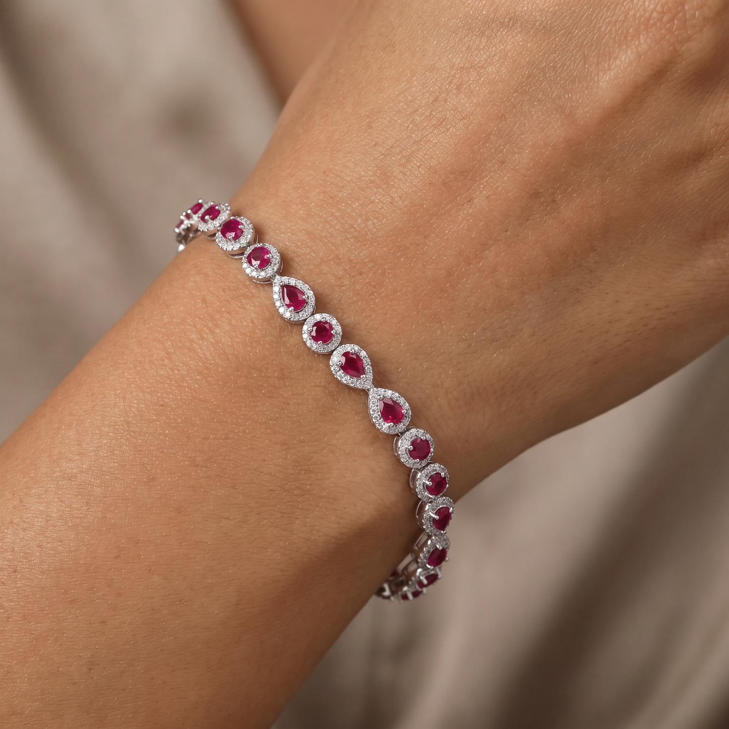 Rhodium Bracelet Featuring Alternating Leaf Elements and Round Links