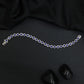 Rhodium Bracelet Featuring Alternating Leaf Elements and Round Links