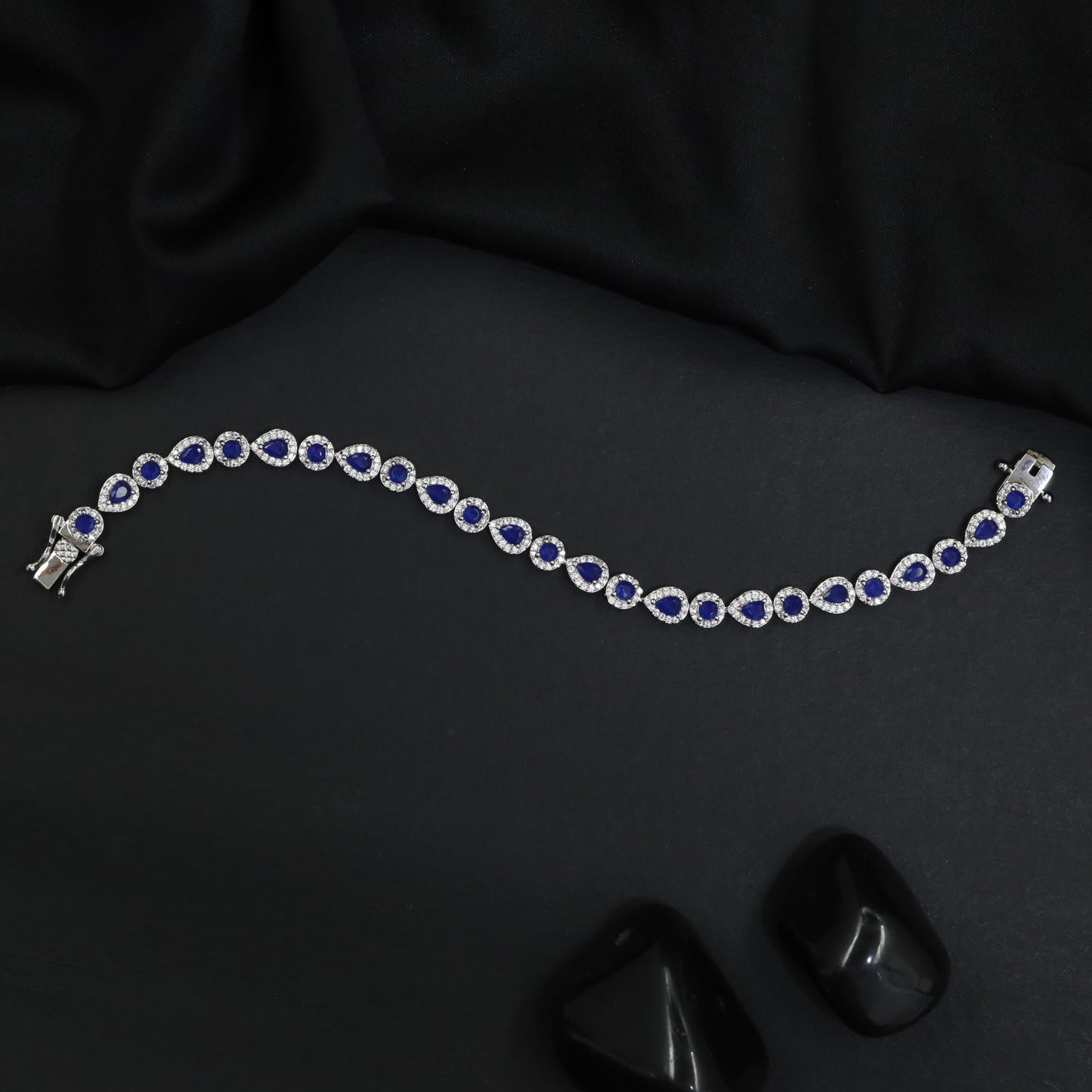 Rhodium Bracelet Featuring Alternating Leaf Elements and Round Links