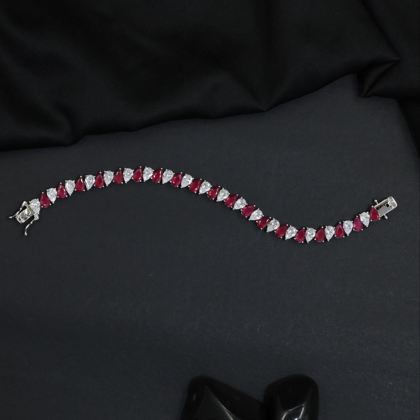 Contemporary Rhodium Bracelet with Repeating Leaf Arrangement