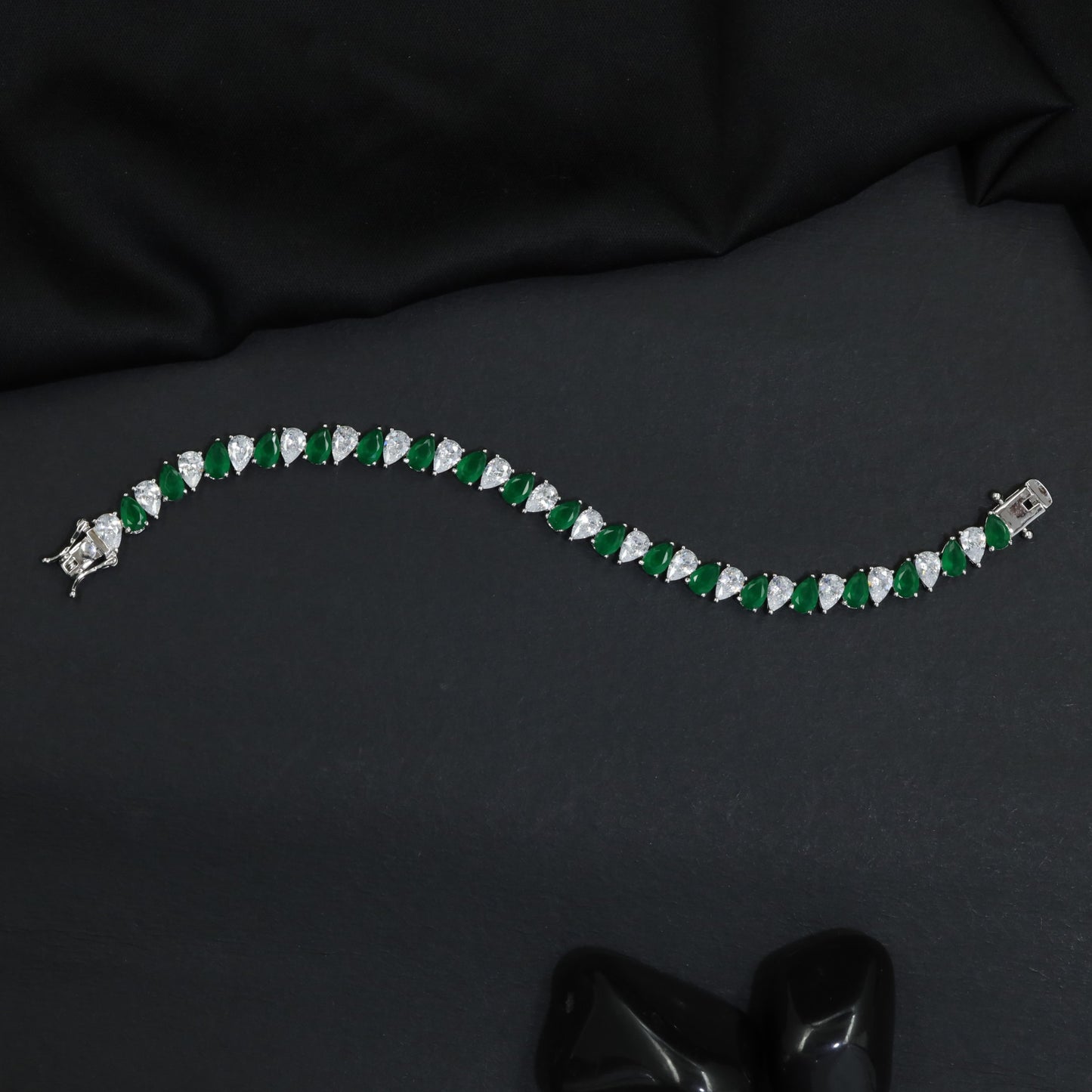 Contemporary Rhodium Bracelet with Repeating Leaf Arrangement