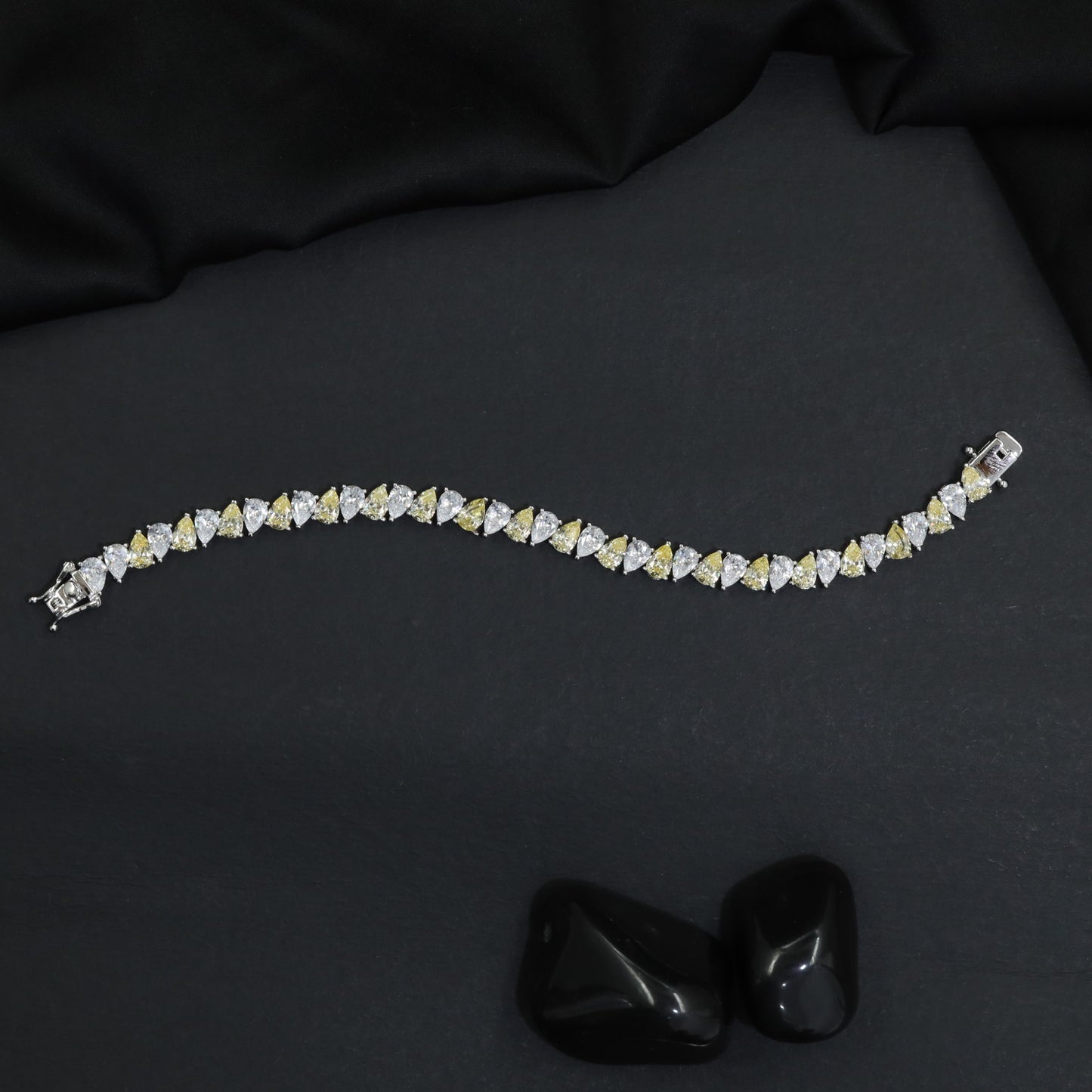 Contemporary Rhodium Bracelet with Repeating Leaf Arrangement