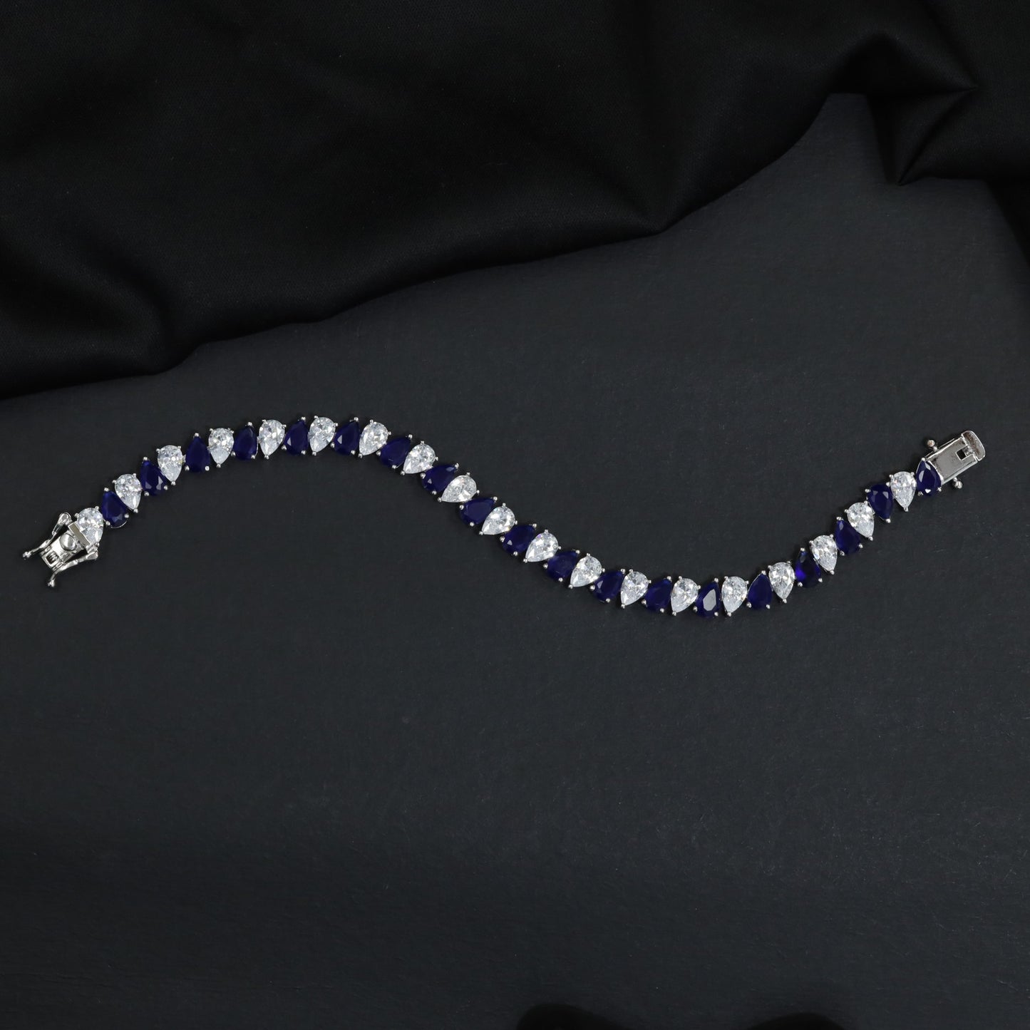 Contemporary Rhodium Bracelet with Repeating Leaf Arrangement