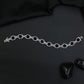 Rhodium Statement Bracelet Featuring Cushion Design and Linked Details